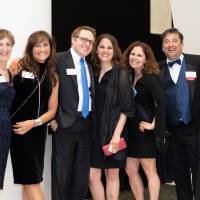 Group of guests posing in the Grand Gallery.